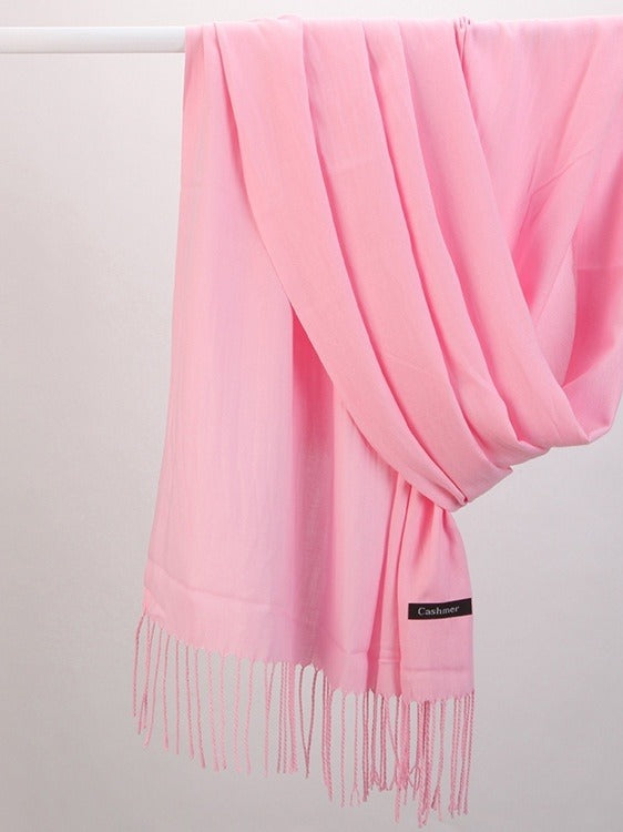 Woman wearing a soft wine red scarf