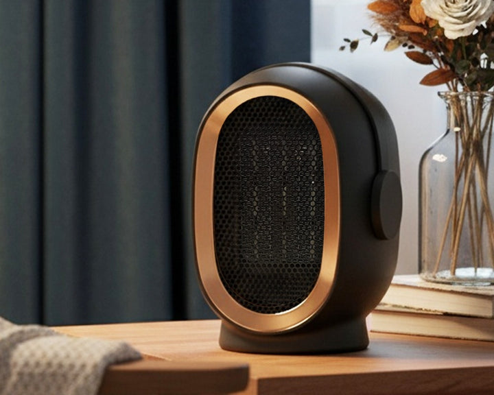Compact ceramic space heater on desk