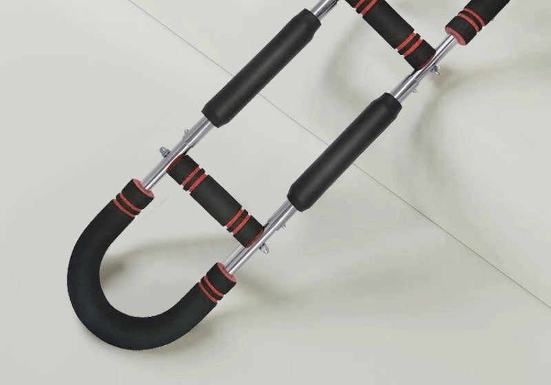 Man training with a U-shaped chest exerciser