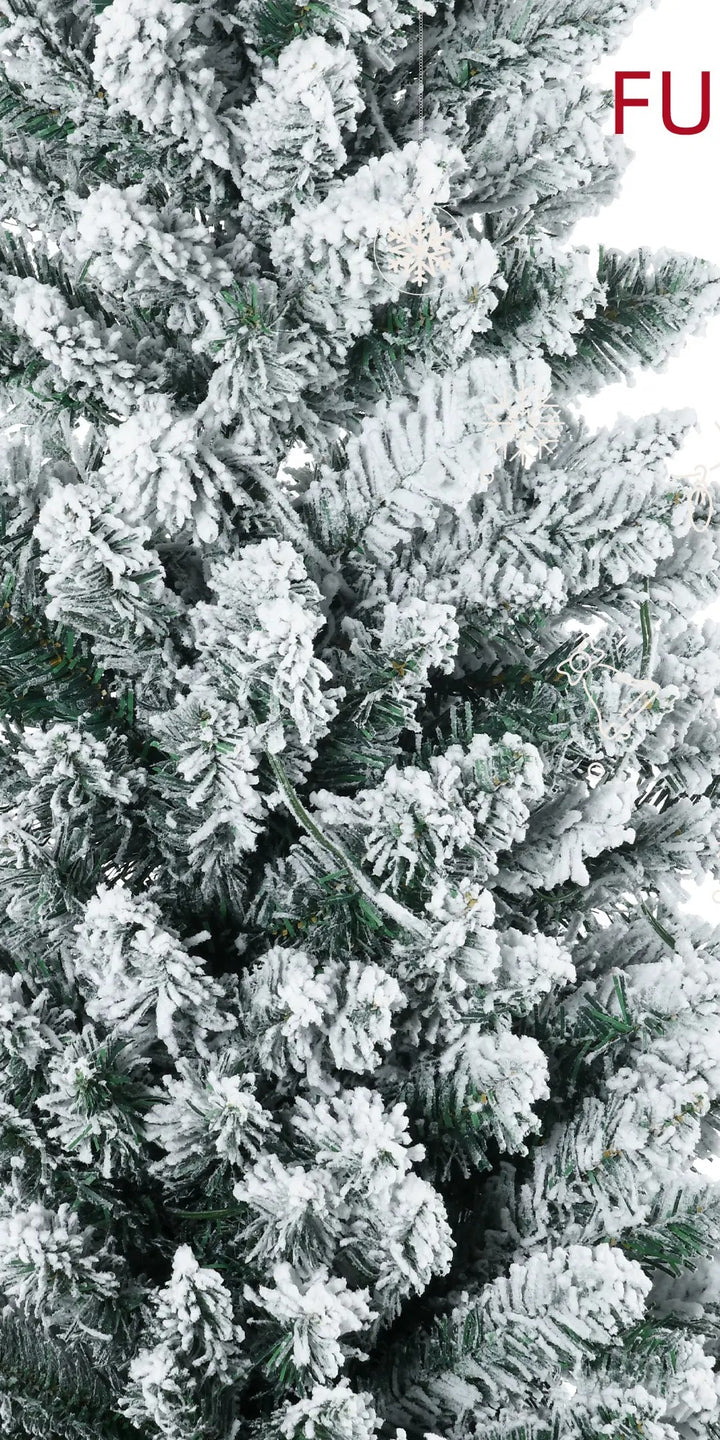Pre-lit snow flocked pencil tree glowing warm