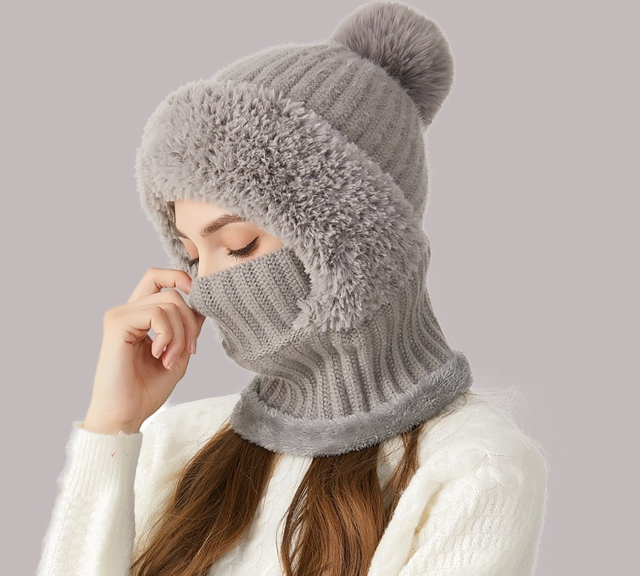 Woman wearing knit hood with scarf