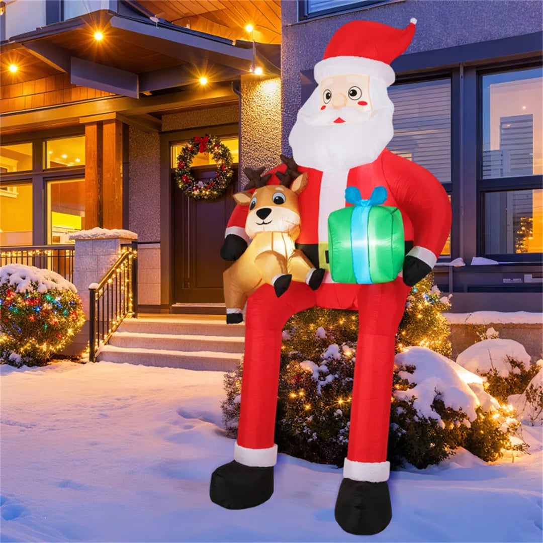 Giant inflatable sitting Santa with reindeer