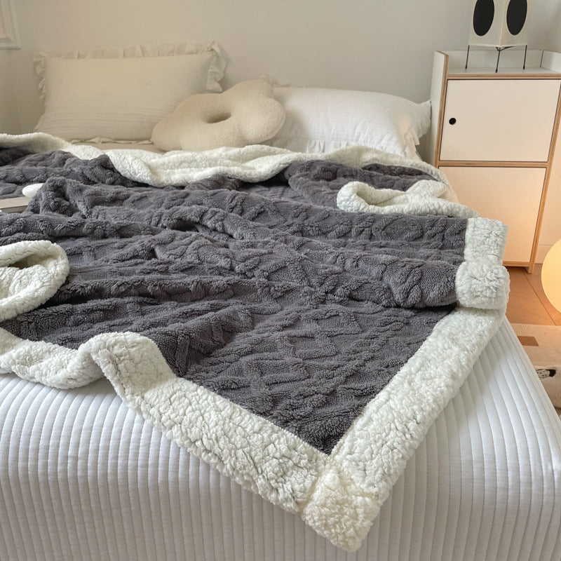 Cable-knit jacquard blanket with sherpa border
