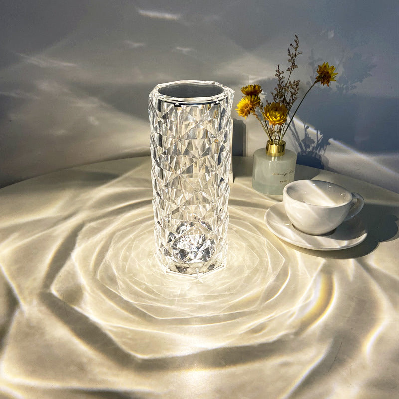 Crystal rose lamp projecting rose shadows