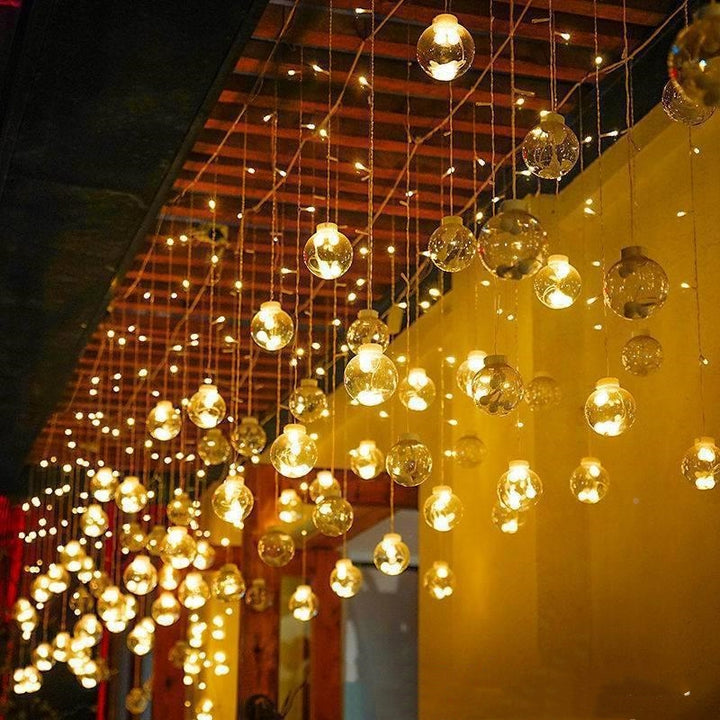 LED globe curtain lights in window