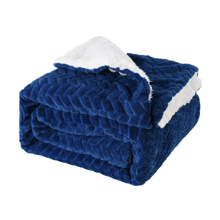 Thick sherpa fleece throw on a sofa