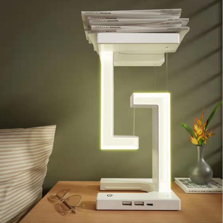 White floating lamp charging a phone