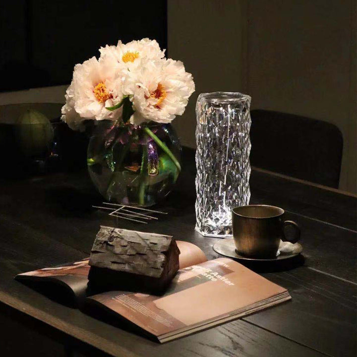 Crystal rose lamp projecting rose shadows