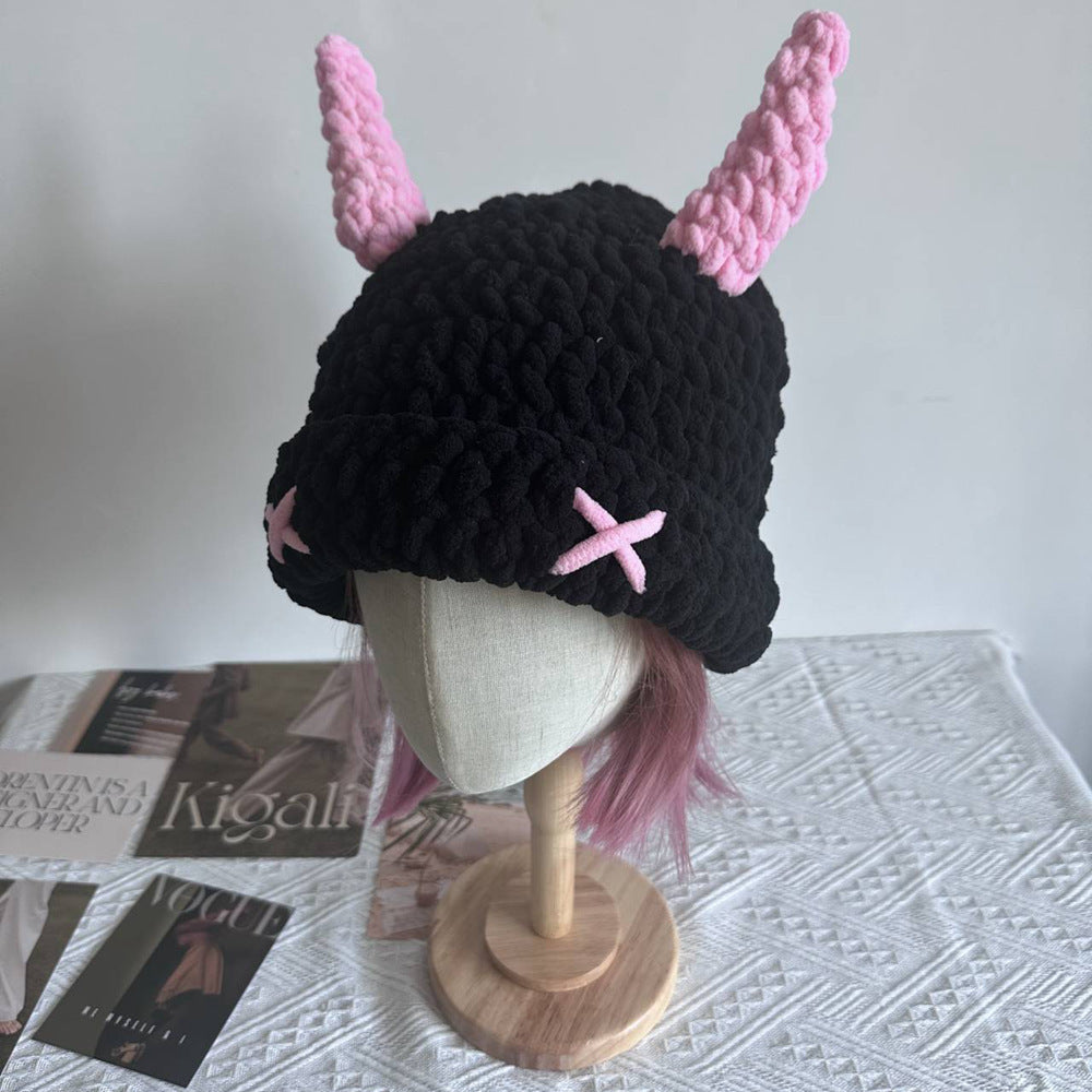 Black chunky crochet bucket hat with pink horns
