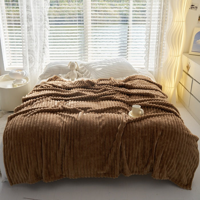 Ribbed faux rabbit fur blanket on bed