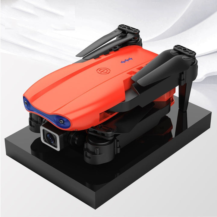 Black foldable camera drone in flight