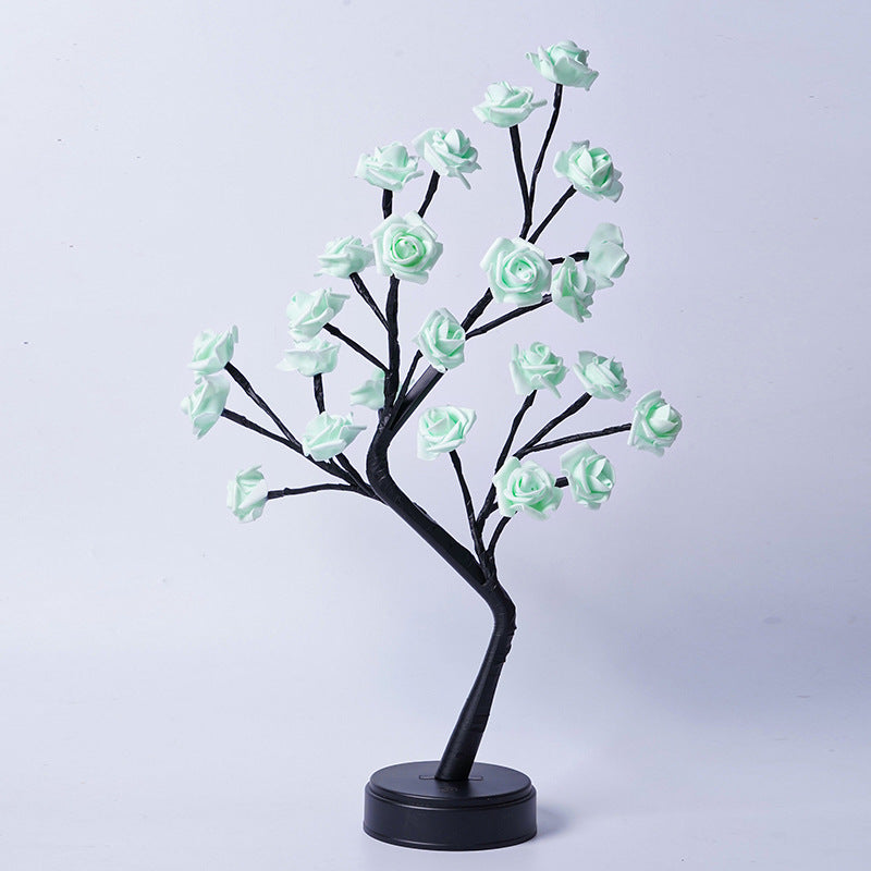 Glowing rose tree lamp on a table