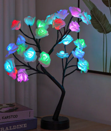 Glowing rose tree lamp on a table