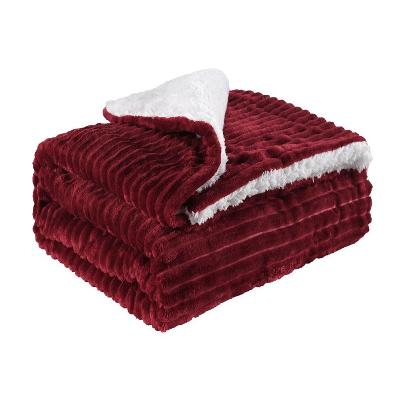 Thick sherpa fleece throw on a sofa