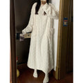 Woman in a long pink fleece nightgown