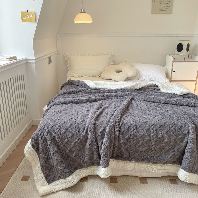 Cable-knit jacquard blanket with sherpa border
