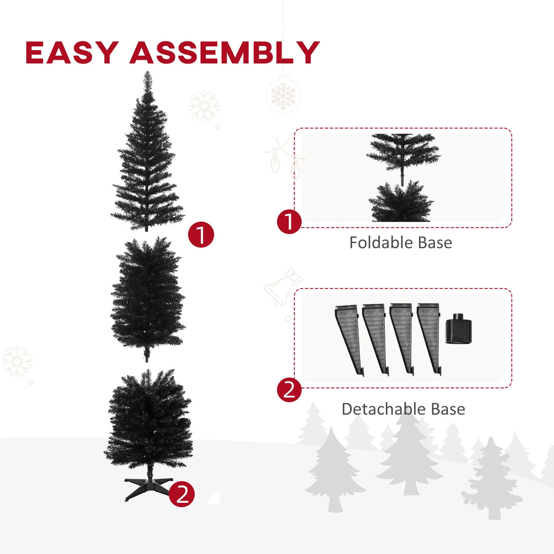 Slim black pencil Christmas tree in a living room