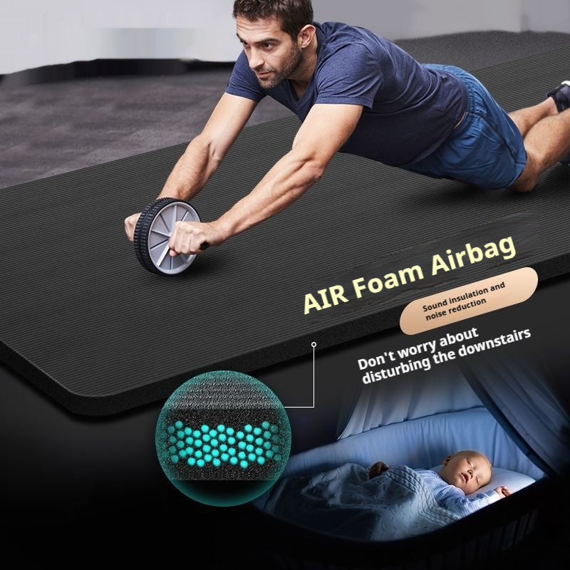 Rolled black yoga mat with carry strap