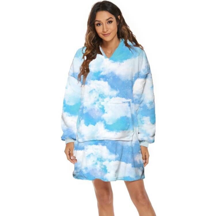 Person wearing oversized hooded blanket