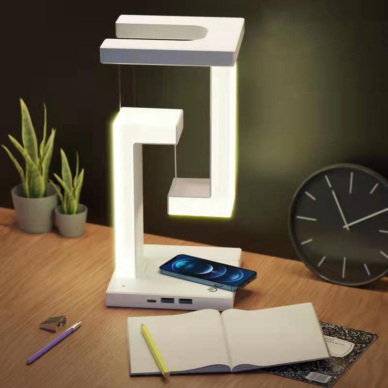 White floating lamp charging a phone