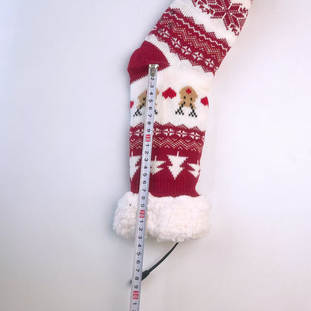 Red knitted Christmas socks with Santa pattern