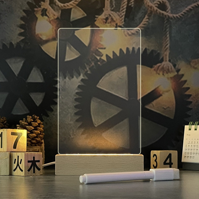 Glowing acrylic message board lamp on wooden base